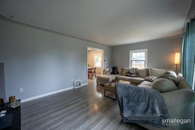 5161 Grand River Dr NE, Grand Rapids, MI 49525 - living area with dark wood-style flooring and baseboards