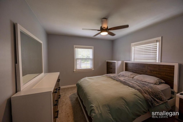 5161 Grand River Dr NE, Grand Rapids, MI 49525 - bedroom featuring dark carpet and ceiling fan