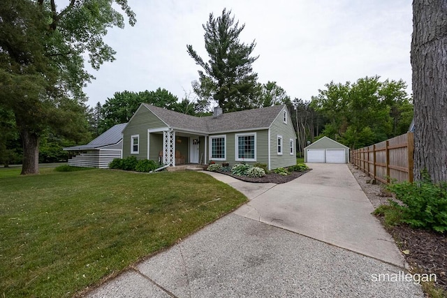 5161 Grand River Dr NE, Grand Rapids, MI 49525 - ranch-style home featuring a detached garage, a chimney, and an outbuilding