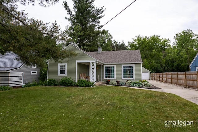5161 Grand River Dr NE, Grand Rapids, MI 49525 - view of front of home with a chimney and a detached garage