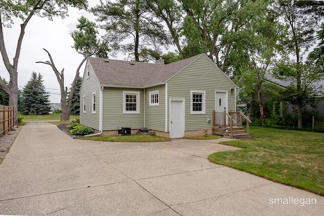 5161 Grand River Dr NE, Grand Rapids, MI 49525 - view of front facade with a shingled roof and a chimney