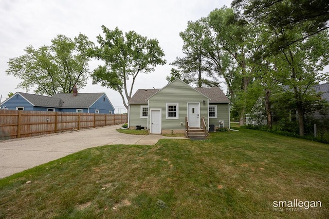 5161 Grand River Dr NE, Grand Rapids, MI 49525 - rear view of property with roof with shingles