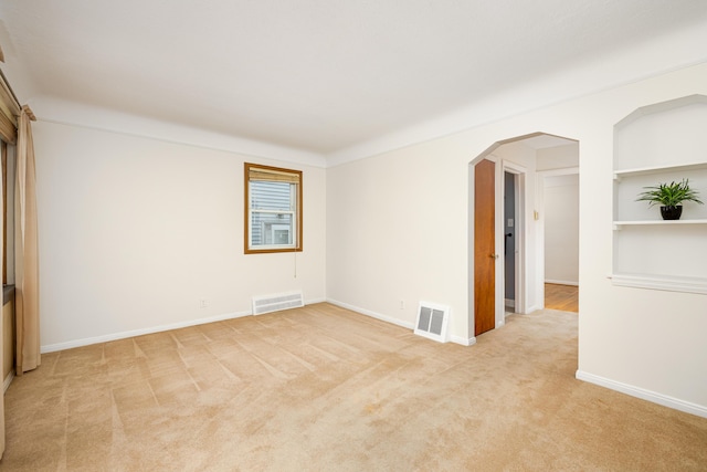 639 Cleveland, Lincoln Park, MI 48146 - unfurnished room featuring light carpet and arched walkways