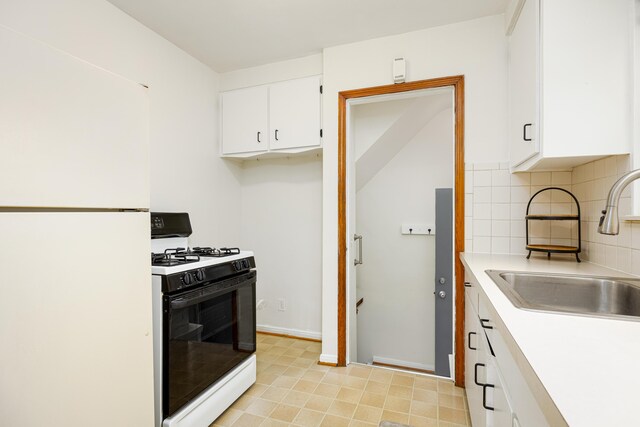 639 Cleveland, Lincoln Park, MI 48146 - kitchen with white appliances, tasteful backsplash, white cabinetry, and light countertops
