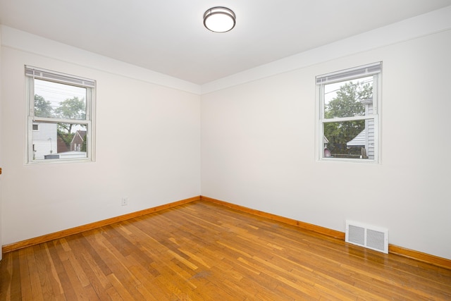 639 Cleveland, Lincoln Park, MI 48146 - empty room featuring healthy amount of natural light and light wood-style floors