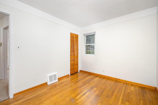 639 Cleveland, Lincoln Park, MI 48146 - empty room with baseboards and light wood-style flooring