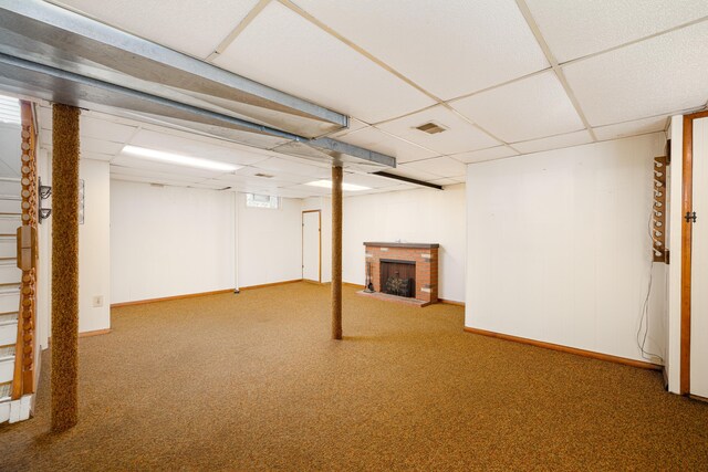 639 Cleveland, Lincoln Park, MI 48146 - finished below grade area with a paneled ceiling, a brick fireplace, and carpet flooring