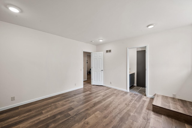 13060 Broadway Rd, Three Rivers, MI 49093 - unfurnished bedroom with wood finished floors and ensuite bath