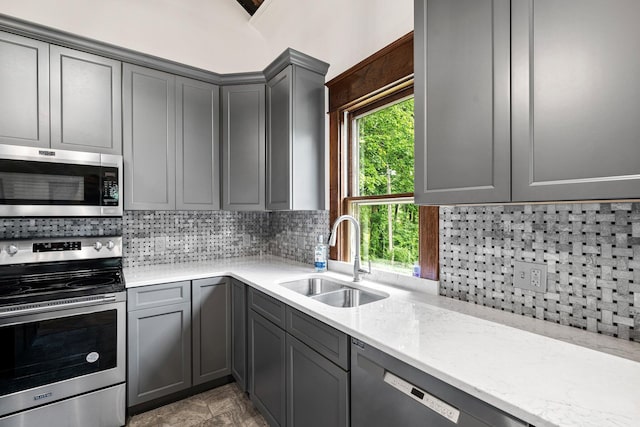 13060 Broadway Rd, Three Rivers, MI 49093 - kitchen with appliances with stainless steel finishes, gray cabinets, and plenty of natural light