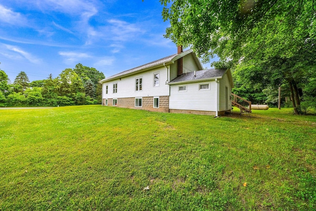 13060 Broadway Rd, Three Rivers, MI 49093 - rear view of property with a lawn and a chimney