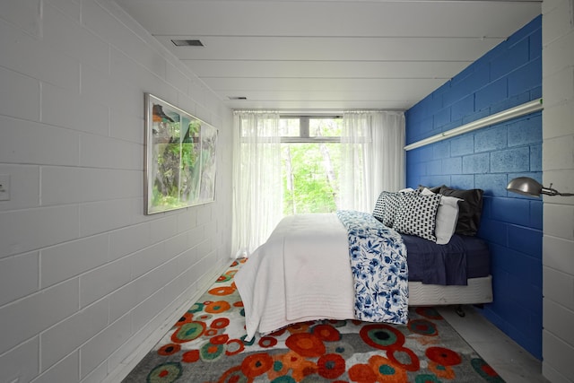 4075 N Delhi Rd, Ann Arbor, MI 48103 - bedroom featuring multiple windows and concrete block wall
