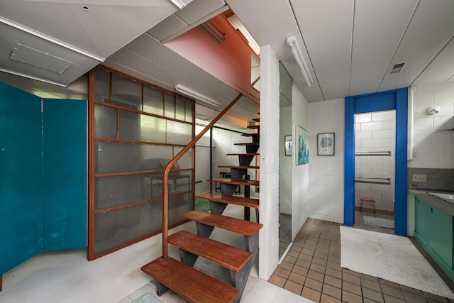 4075 N Delhi Rd, Ann Arbor, MI 48103 - staircase with concrete block wall