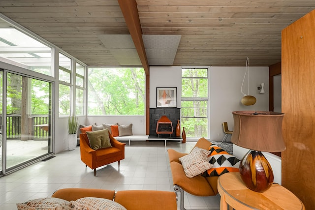 4075 N Delhi Rd, Ann Arbor, MI 48103 - living area with tile patterned flooring, a wooden ceiling with exposed beams, and a wall of windows