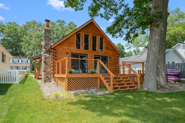 9715 Woodlawn Dr, Portage, MI 49002 - back of house with log siding, a chimney, a wooden deck, and stairs