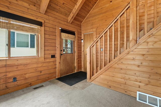 9715 Woodlawn Dr, Portage, MI 49002 - foyer featuring wood ceiling, carpet, stairway, and wood walls