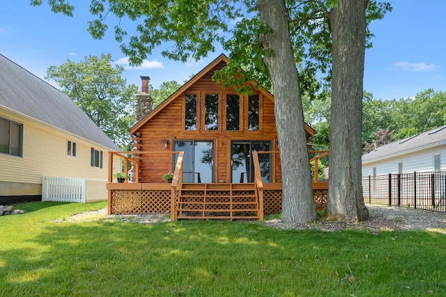 9715 Woodlawn Dr, Portage, MI 49002 - back of property featuring a chimney, a deck, and log siding