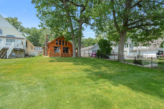 9715 Woodlawn Dr, Portage, MI 49002 - view of yard with stairway and a wooden deck