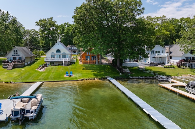 9715 Woodlawn Dr, Portage, MI 49002 - dock with a water view and a lawn