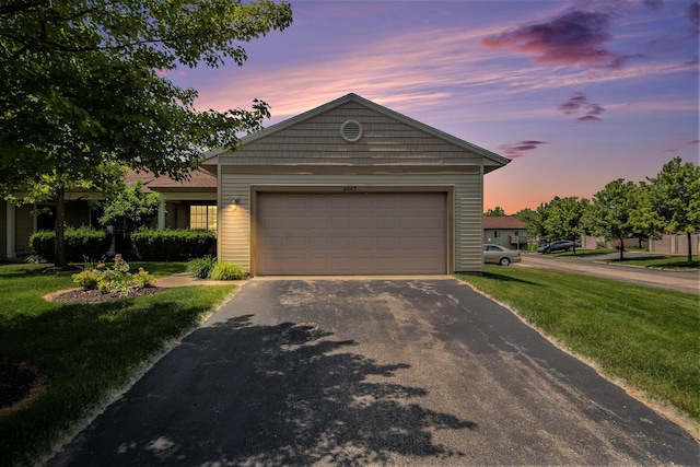 2663 Weatherby Hills Dr SE, Grand Rapids, MI 49546 - single story home featuring asphalt driveway, a lawn, and a garage