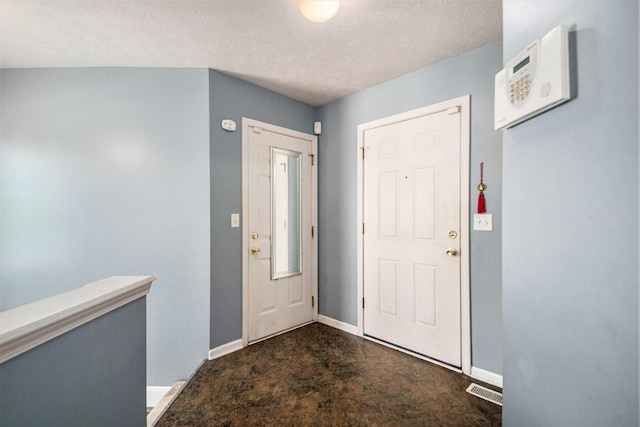 2663 Weatherby Hills Dr SE, Grand Rapids, MI 49546 - carpeted foyer entrance featuring baseboards and a textured ceiling