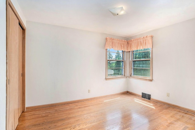 1932 Concord Ave SE, Grand Rapids, MI 49506 - unfurnished bedroom with wood finished floors and a closet