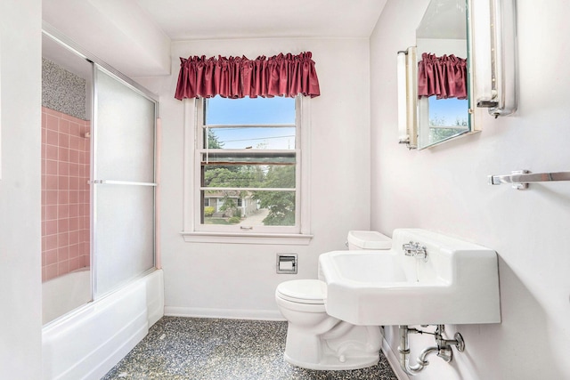 1932 Concord Ave SE, Grand Rapids, MI 49506 - full bathroom with shower / bath combination with glass door and speckled floor
