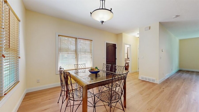 5026 Weatherford Dr, Coloma, MI 49038 - dining space featuring light wood-style flooring and baseboards