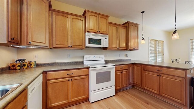 5026 Weatherford Dr, Coloma, MI 49038 - kitchen with white appliances, light wood-type flooring, a peninsula, hanging light fixtures, and brown cabinetry