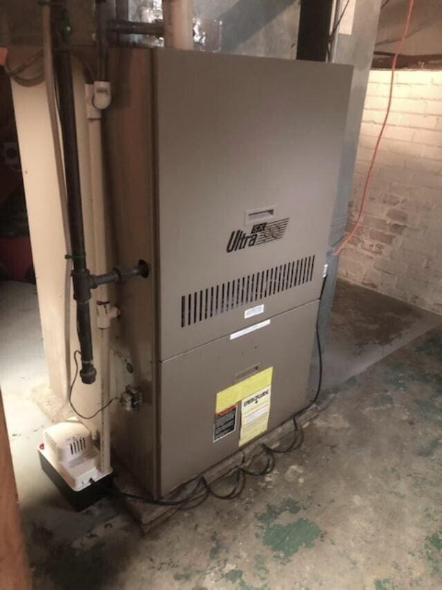 311 Moccasin St, Buchanan, MI 49107 - utility room featuring heating unit
