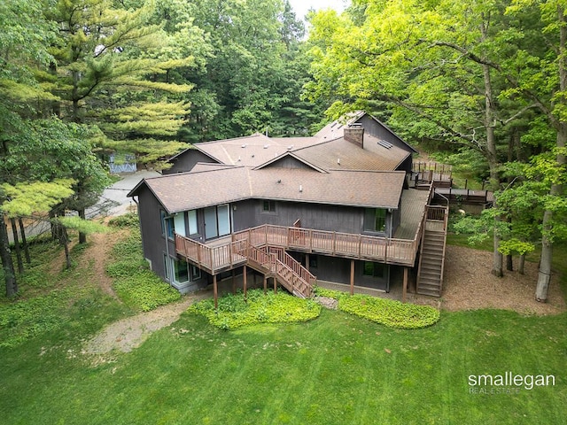 550 Greentree Ln NE, Ada, MI 49301 - rear view of house featuring stairway, roof with shingles, a deck, and a forest view