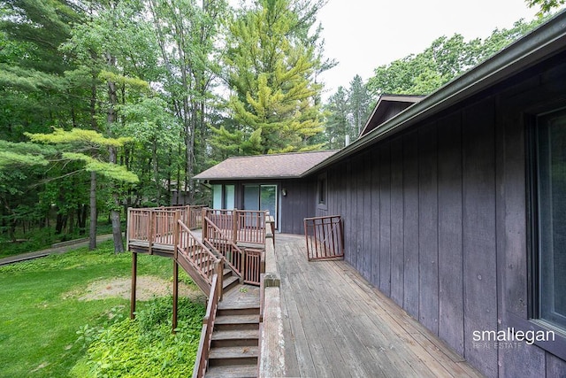 550 Greentree Ln NE, Ada, MI 49301 - deck featuring stairway and a yard
