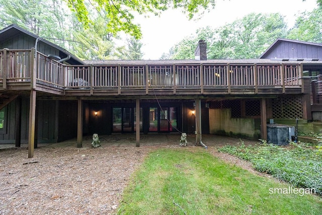550 Greentree Ln NE, Ada, MI 49301 - rear view of property with a deck and board and batten siding