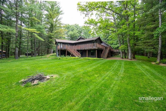 550 Greentree Ln NE, Ada, MI 49301 - view of green lawn with stairway and a wooden deck