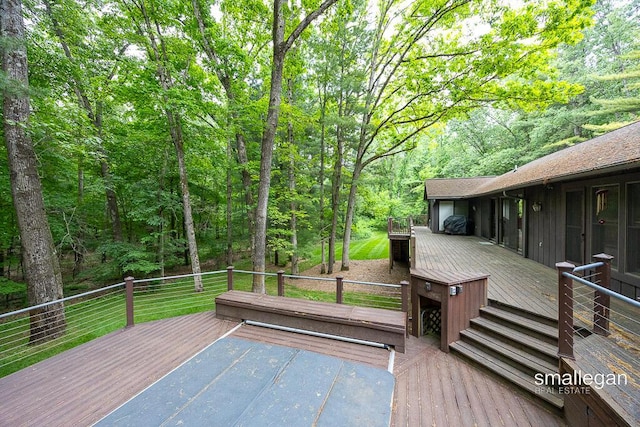 550 Greentree Ln NE, Ada, MI 49301 - wooden terrace featuring a view of trees