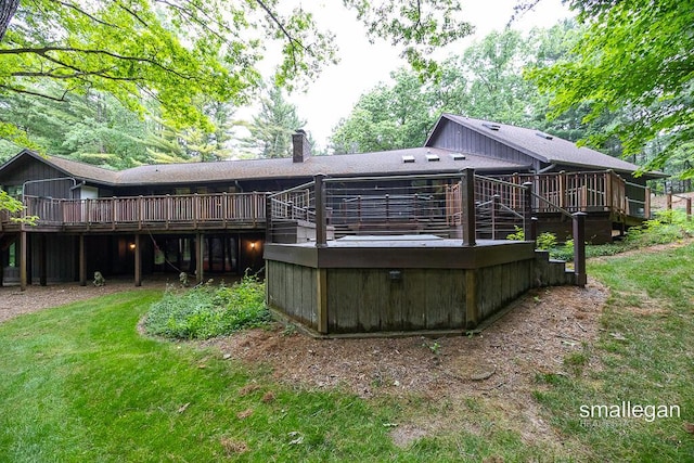 550 Greentree Ln NE, Ada, MI 49301 - back of house with a deck and a chimney