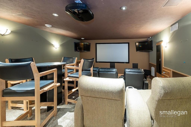 550 Greentree Ln NE, Ada, MI 49301 - home theater room featuring carpet flooring, recessed lighting, and a textured ceiling