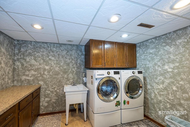 550 Greentree Ln NE, Ada, MI 49301 - laundry room featuring separate washer and dryer, cabinet space, wallpapered walls, and recessed lighting