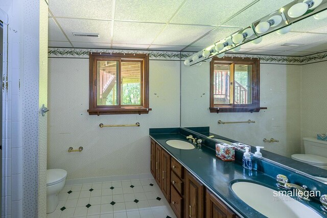 550 Greentree Ln NE, Ada, MI 49301 - full bathroom with a drop ceiling, healthy amount of natural light, and double vanity