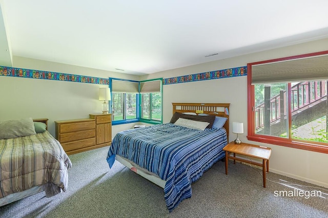 550 Greentree Ln NE, Ada, MI 49301 - carpeted bedroom featuring baseboards
