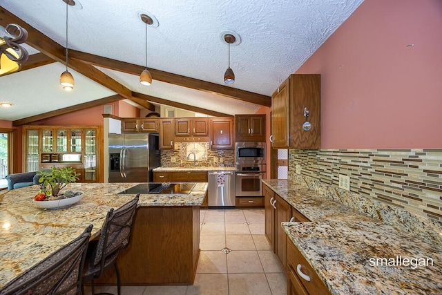 550 Greentree Ln NE, Ada, MI 49301 - kitchen with stainless steel appliances, tasteful backsplash, brown cabinetry, pendant lighting, and light tile patterned flooring