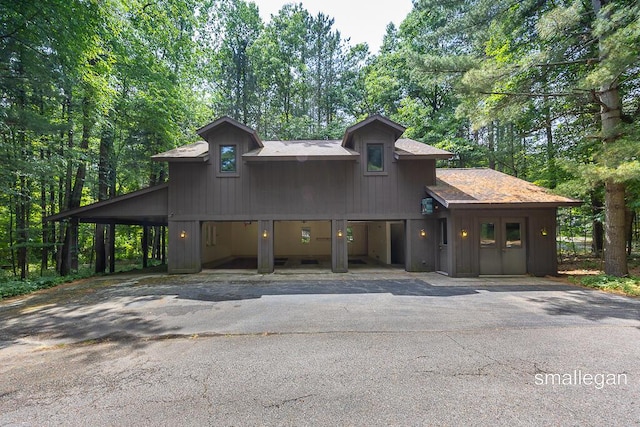 550 Greentree Ln NE, Ada, MI 49301 - view of front of home with a garage and driveway