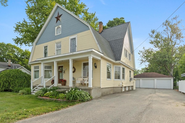 3155 24th Ave, Hudsonville, MI 49426 - colonial inspired home featuring a gambrel roof, a garage, covered porch, an outdoor structure, and a shingled roof