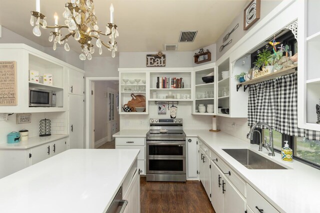 3155 24th Ave, Hudsonville, MI 49426 - kitchen featuring open shelves, stainless steel appliances, decorative backsplash, a chandelier, and white cabinets