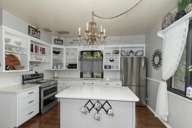 3155 24th Ave, Hudsonville, MI 49426 - kitchen featuring open shelves, appliances with stainless steel finishes, a chandelier, dark wood finished floors, and a wainscoted wall
