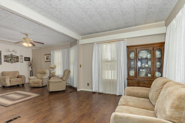 3155 24th Ave, Hudsonville, MI 49426 - living area featuring ornamental molding, wood finished floors, a ceiling fan, and beamed ceiling
