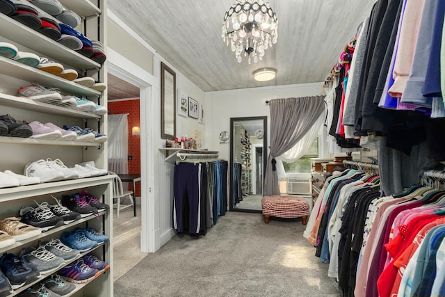 3155 24th Ave, Hudsonville, MI 49426 - walk in closet featuring carpet, cooling unit, and a chandelier