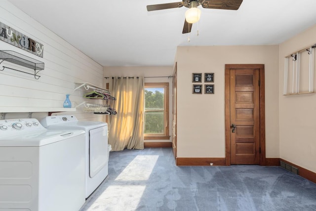 3155 24th Ave, Hudsonville, MI 49426 - laundry area with washer and dryer, light colored carpet, a ceiling fan, and wood walls