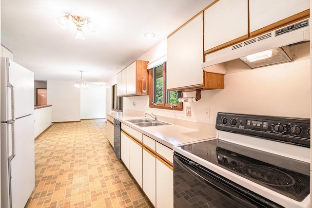 4104 Rurik Dr, Howell, MI 48843 - kitchen featuring electric range, freestanding refrigerator, under cabinet range hood, light countertops, and light flooring