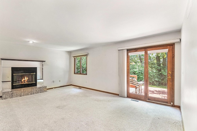 4104 Rurik Dr, Howell, MI 48843 - unfurnished living room with carpet flooring and a glass covered fireplace