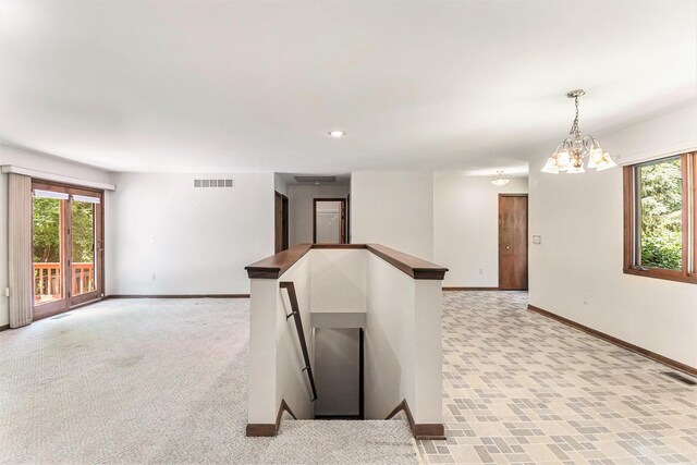 4104 Rurik Dr, Howell, MI 48843 - spare room with plenty of natural light and a chandelier